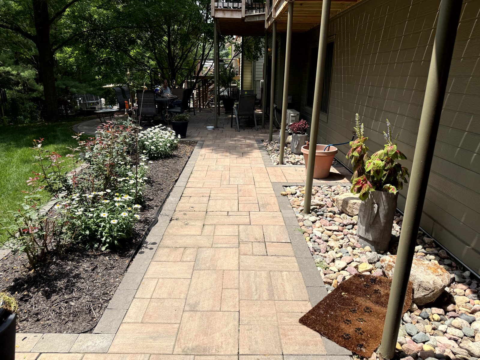 Paver walkway with flower landscaping